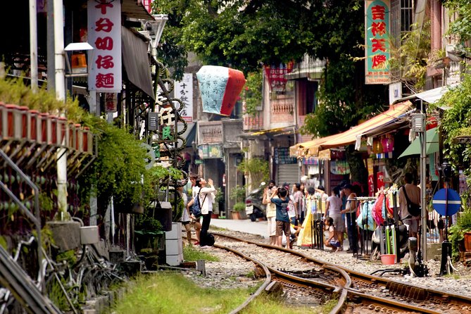 Private Jiufen & Pingxi Day Tour with English-Speaking Guide - Shifen Waterfall adds the strongest outdoor stop