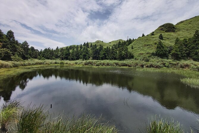 Private Yangmingshan National Park Hiking Day Tour from Taipei - Qingtiangang Grassland and open views