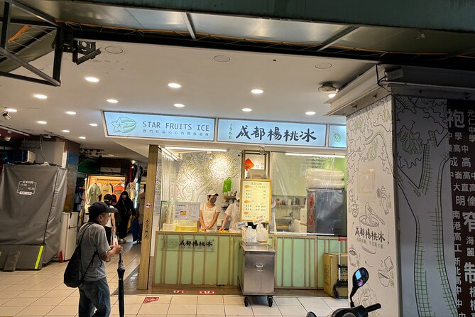 Taipei Foodie and History Walking Tour - Walking toward Ximending with a food guide