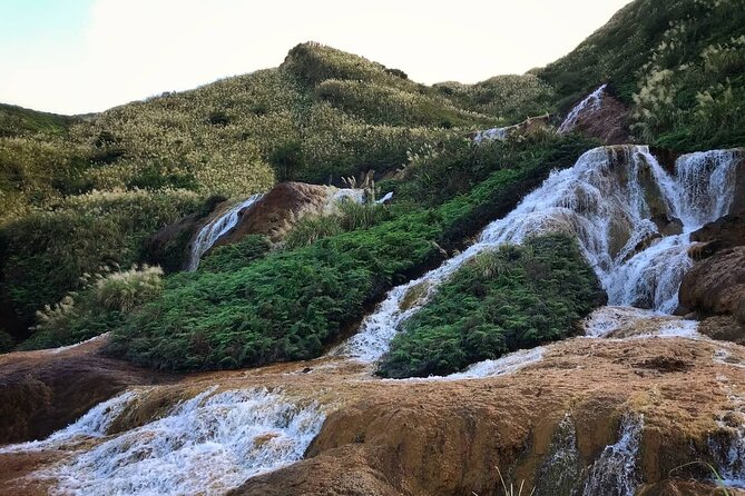 Taipei's Old Gold Rush Town: Jiufen Guided Night Tour - The Golden Waterfall sets the mood